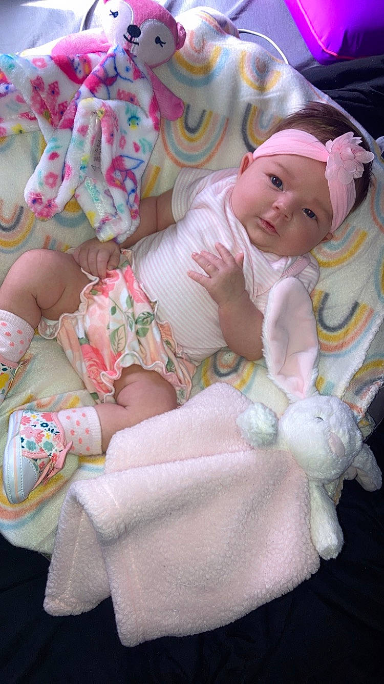 Kynleigh is registered to the contest to win money with this photo: abdomen, baby, baby_products, baby_toddler_clothing, cheek, child, comfort, hand, head, headgear, headwear, human_body, human_leg, person, pink, product, skin, smile, thigh, toddler