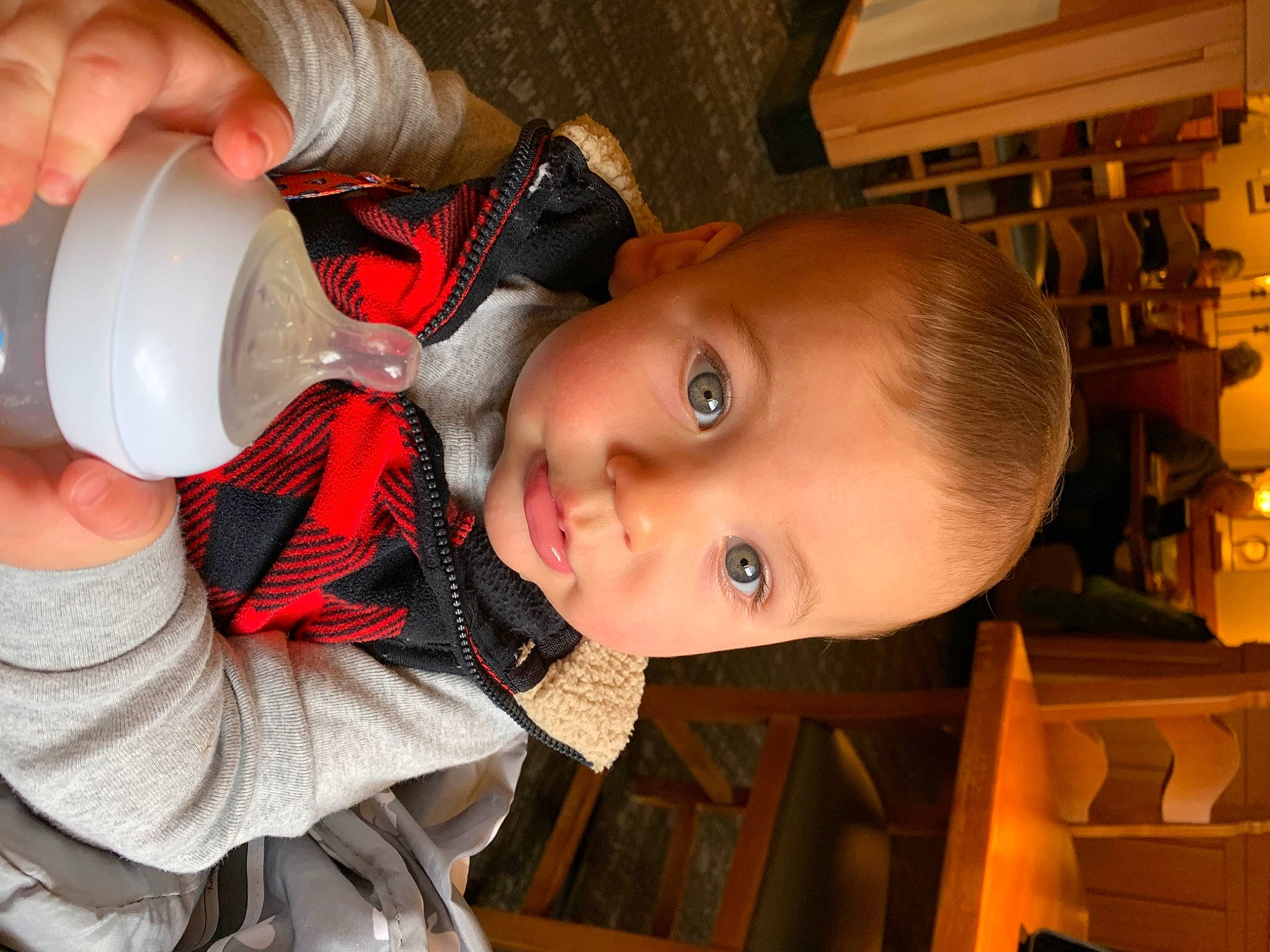 Landen is registered to the contest to win money with this photo: baby, cheek, drinkware, ear, eye, eyelash, gesture, hand, happy, head, iris, lip, mouth, nail, nose, person, plastic_bottle, skin, toddler, water