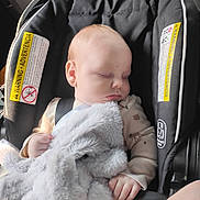 Hunter joined the competition — help win amazing prizes! baby, car_seat, sleeping, stuffed_animal, blanket, child, infant, seatbelt, soft_toy, clothing, indoor, person, head, peaceful, rest, cute, hand, warning_label, fabric, transportation