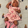 adorable, baby, blanket, bow, child, cute, fashion, headband, indoor, infant, laying_down, newborn, peaceful, pink_clothing, portrait, sleeping, sock, soft_lighting, striped_blanket, teddy_bear