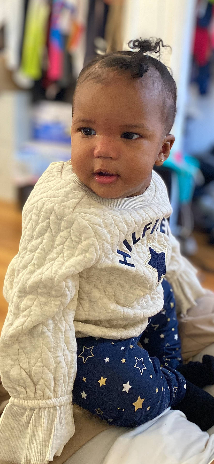 Janiyah is registered to the contest to win money with this photo: baby, baby_toddler_clothing, cheek, child, electric_blue, eye, eyelash, face, fun, hair, hairstyle, happy, head, iris, nose, person, sitting, skin, sleeve, standing