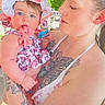 baby, woman, tattoos, outdoor, hat, child, holding, affection, summer, sunhat, portrait, person, cute, patterned_clothing, nature, family, love, casual, daylight, shade