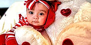 Ainnara joined the competition — help win amazing prizes! adorable, baby, blanket, child, comfort, cozy, cuddly, cute, headband, heart_shape, hugging, indoor, infant, plush_toy, portrait, red_and_white, smiling, soft_texture, striped_clothing, teddy_bear