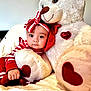 Ainnara joined the competition — help win amazing prizes! baby, child, teddy_bear, plush_toy, red_and_white, striped_clothing, headband, heart_shape, cuddly, cute, soft_texture, indoor, blanket, comfort, portrait, smiling, hugging, infant, adorable, cozy
