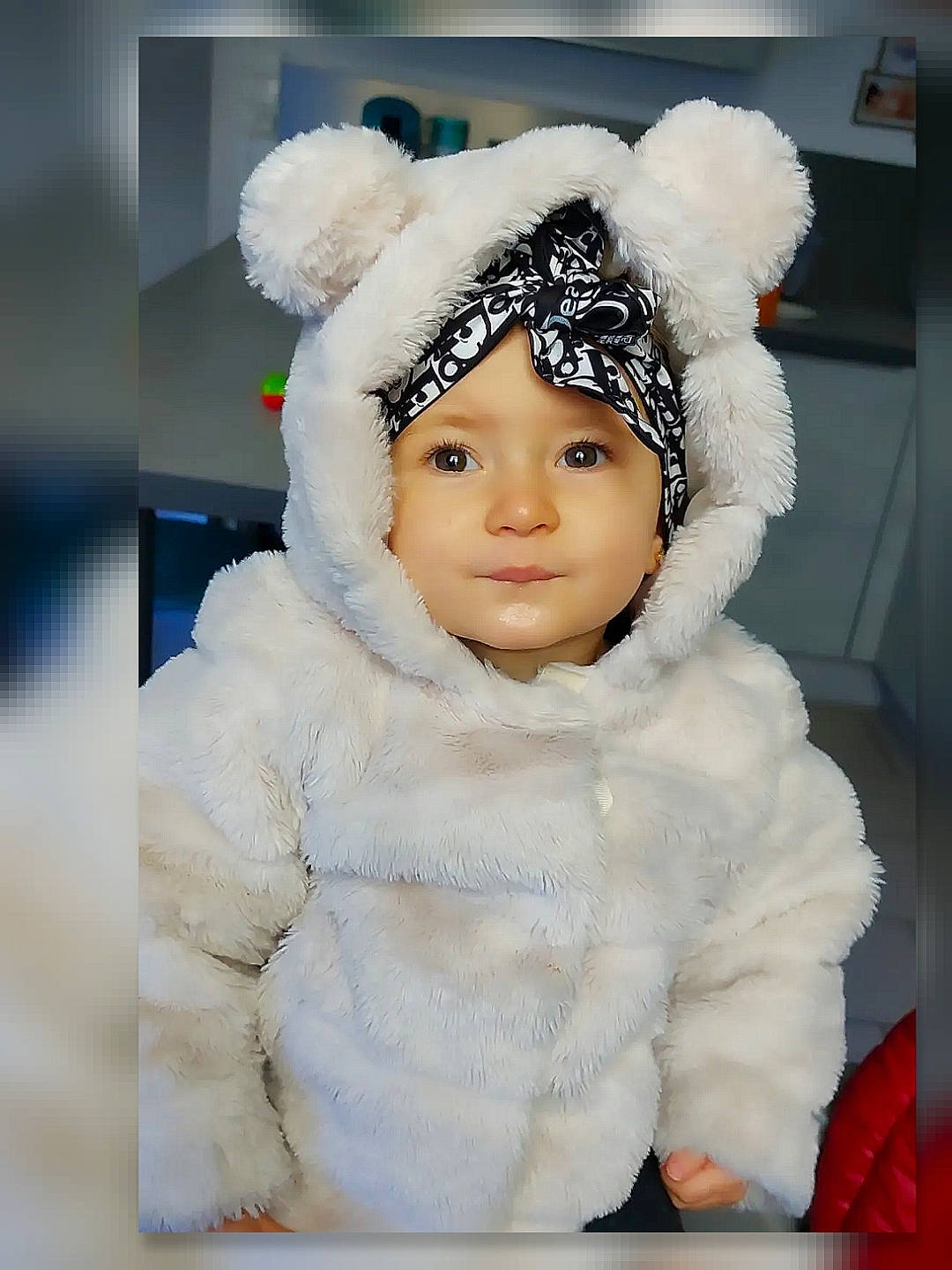 Molly participe au concours pour gagner de l'argent avec cette photo : baby, baby_toddler_clothing, beanie, cap, cheek, eyelash, fashion_accessory, freezing, fur, fur_clothing, gesture, happy, headwear, hood, knit_cap, person, sleeve, street_fashion, textile, toddler