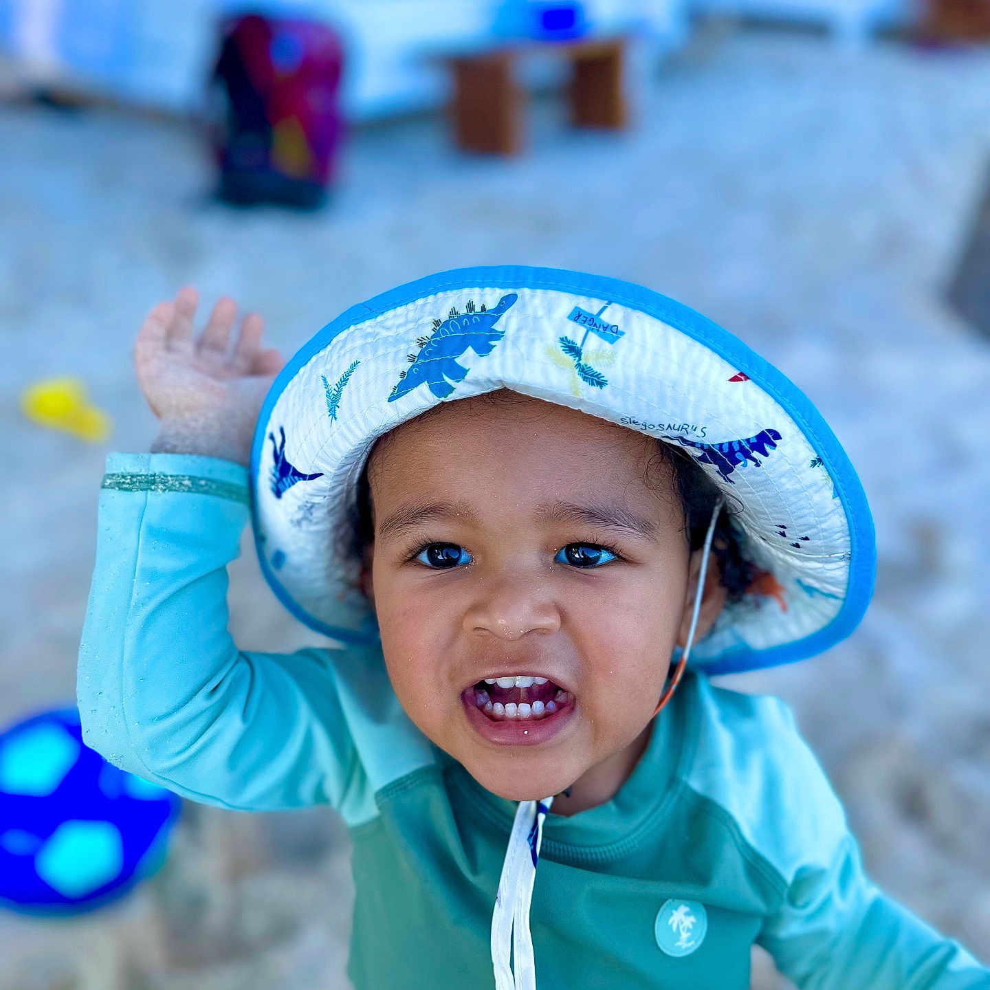 Jayson is registered to the contest to win money with this photo: baby, bodypart, cap, clothing, coat, face, finger, hand, happy, hat, head, jacket, mouth, outdoors, person, photography, portrait, smile, sunhat, teeth