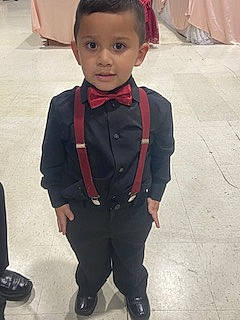 Christopher is registered to the contest to win money with this photo: baby_toddler_clothing, blazer, chair, child, chin, collar, dress_shirt, event, fashion_accessory, fashion_design, flooring, formal_wear, fun, happy, person, sitting, sleeve, toddler, tradition, tuxedo