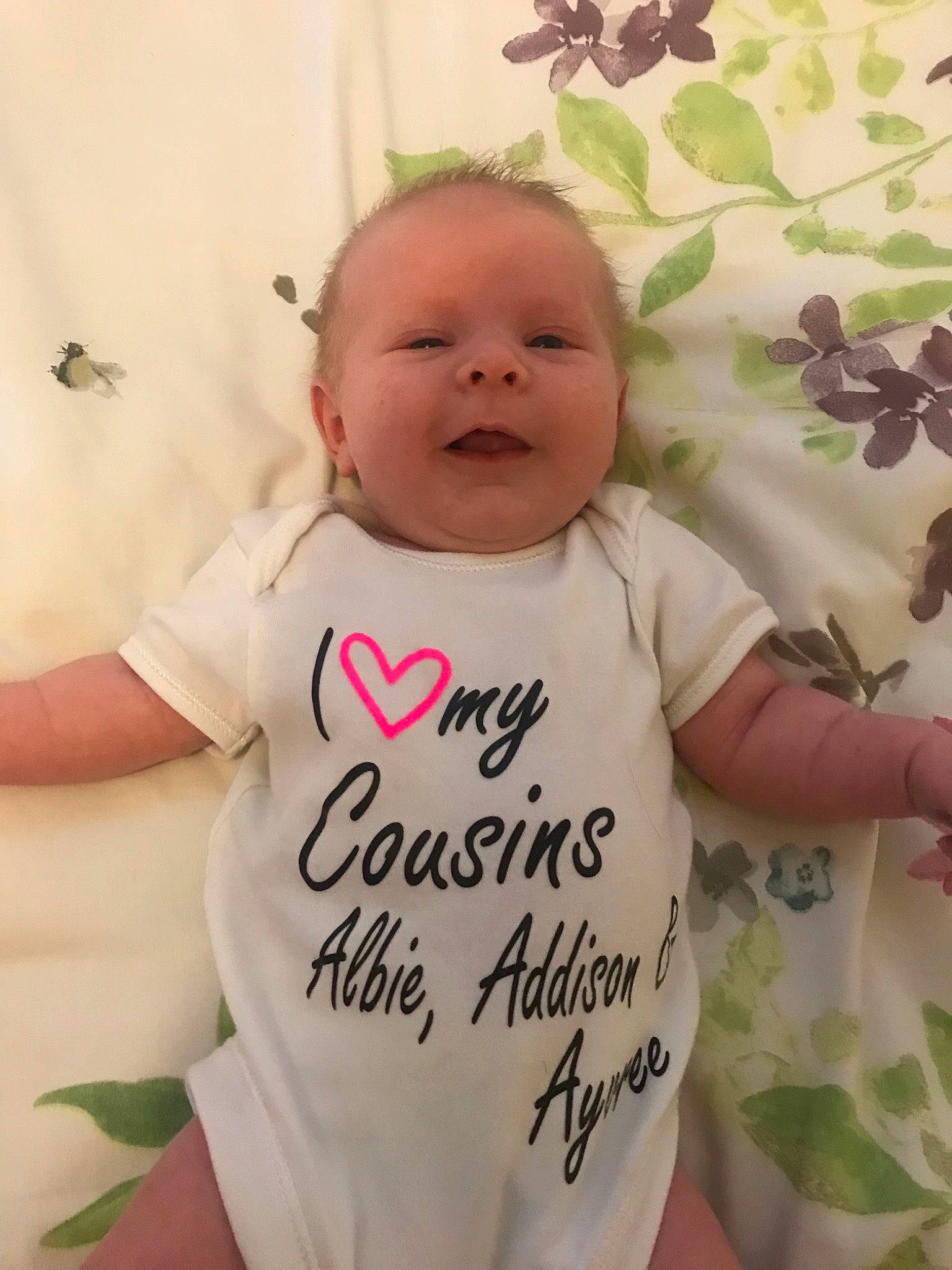 Cordelia is registered to the contest to win money with this photo: baby, baby_products, baby_toddler_clothing, cheek, child, cool, happy, head, person, pink, product, skin, sleeve, smile, t_shirt, toddler