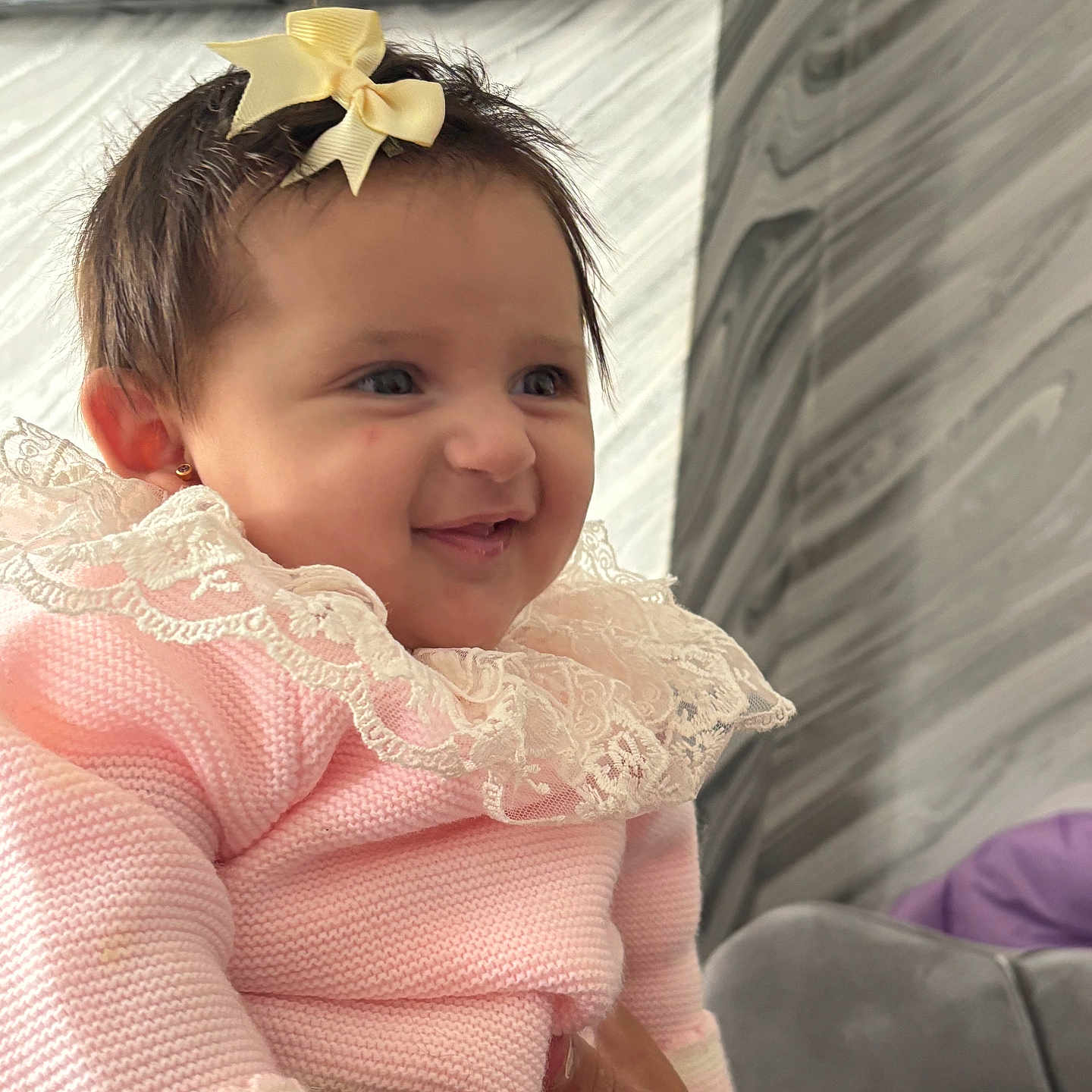 Louanna-Rose joined the competition — help win amazing prizes! apparel, baby, bow, child, cute, earrings, face, fashion, hand, happy, holding, indoor, infant, lace, marble, person, pink_clothing, portrait, smiling, wall