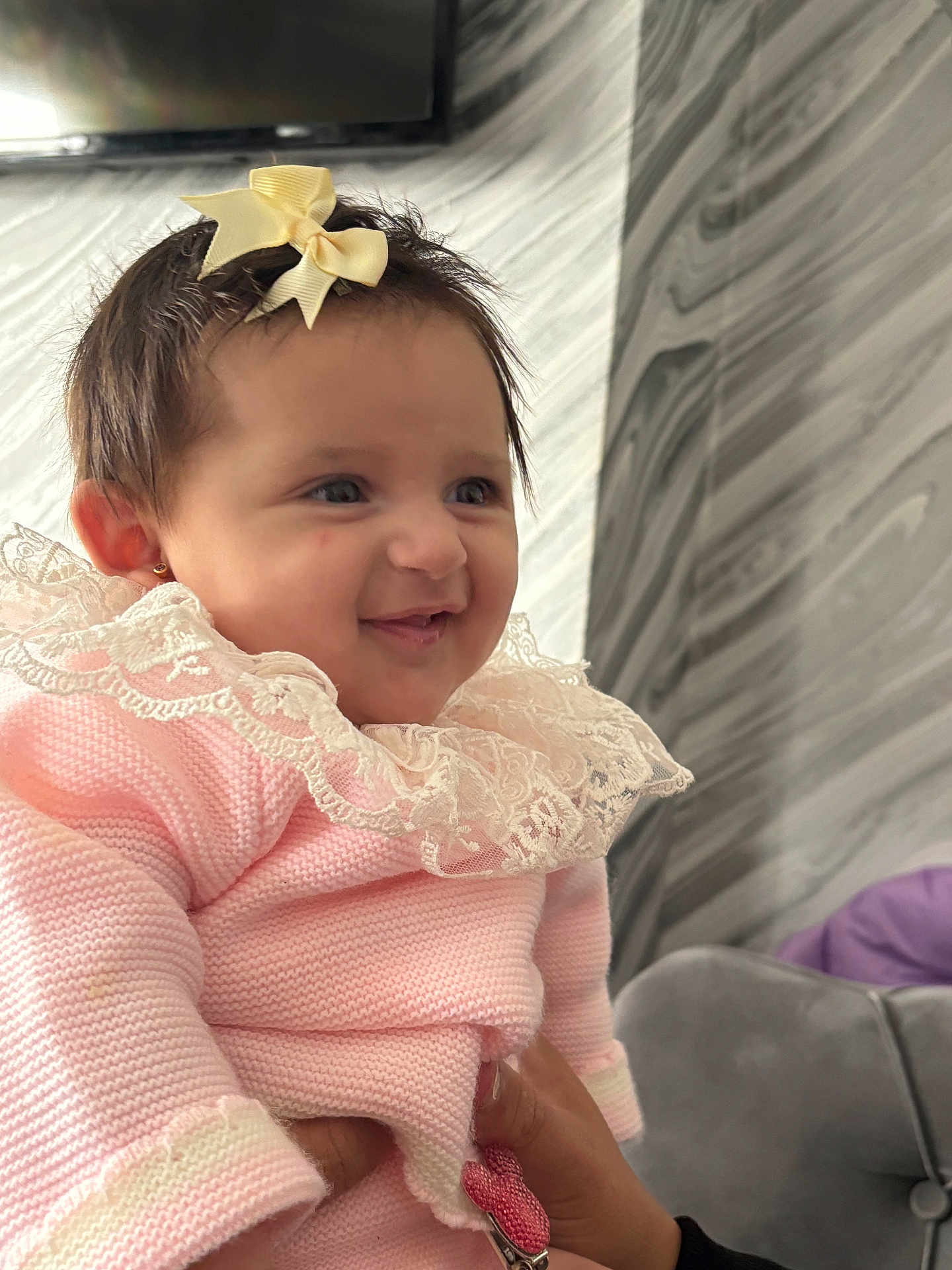 Louanna-Rose joined the competition — help win amazing prizes! baby, child, smiling, bow, lace, pink_clothing, hand, face, portrait, indoor, cute, happy, earrings, person, holding, apparel, fashion, infant, wall, marble