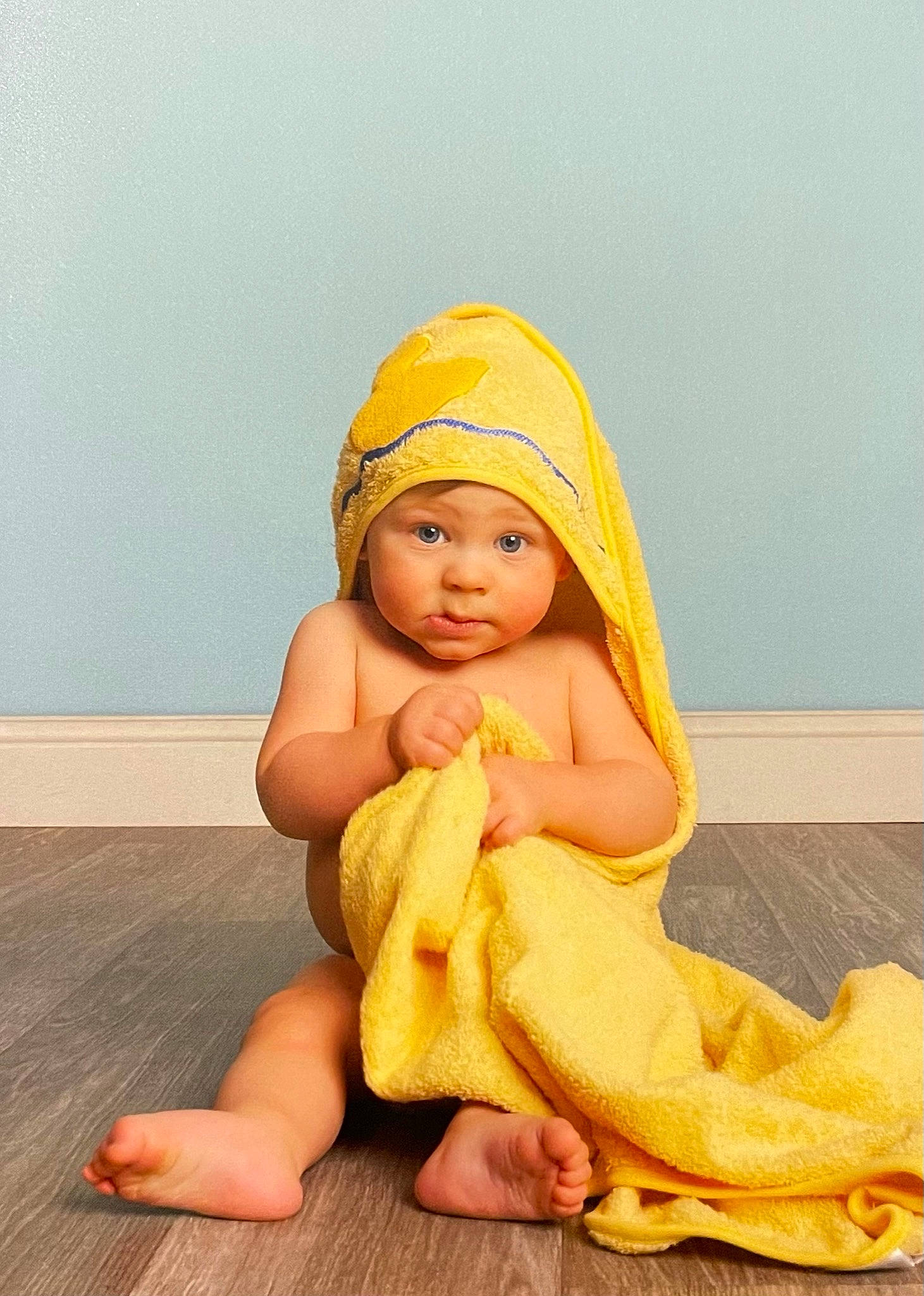 Beckham is registered to the contest to win money with this photo: baby, baby_toddler_clothing, barefoot, child, comfort, costume, flooring, foot, fun, headwear, human_leg, peach, person, sitting, thumb, toddler, vacation, wood