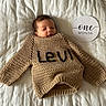 Levi joined the competition — help win amazing prizes! baby, bed, blanket, cardigan, clothing, cushion, face, furniture, glove, hat, head, homedecor, hoodie, knitwear, newborn, person, photography, portrait, sweater, sweatshirt