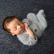 Levi is registered to the contest to win money with this photo: baby, blanket, bodypart, clothing, face, finger, glove, hand, happy, head, knitwear, newborn, person, photography, portrait, sleeping, smile, sweater, yawning