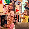 child, children, painting, art, indoors, smiling, girl, boy, easel, canvas, color, creative, activity, hobby, happy, casual_clothing, table, home, play, fun