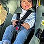 Malya participe au concours pour gagner de l'argent avec cette photo : baby, car_seat, smile, child, happy, sitting, seatbelt, clothing, pants, socks, sunlight, outdoor, safety, infant, cute, portrait, babywear, car, seat, toddler