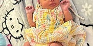 Lola joined the competition — help win amazing prizes! baby, blanket, child, colorful_dress, cozy, cute, fabric, footwear, hands_up, hello_kitty, indoors, infant, lying_down, newborn, pastel_colors, pattern, pink_headband, sleepwear, socks, soft_texture