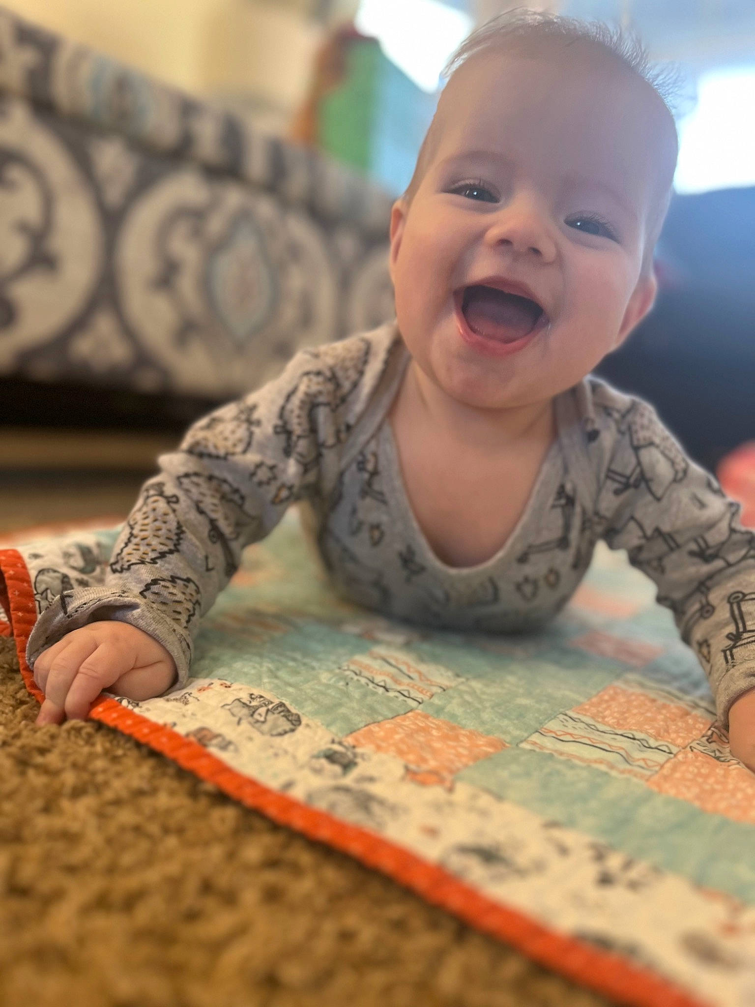 Owen joined the competition — help win amazing prizes! arm, baby, baby_toddler_clothing, cheek, crawling, face, finger, floor, flooring, fun, hand, happy, head, mouth, person, skin, sleeve, smile, toddler, tummy_time