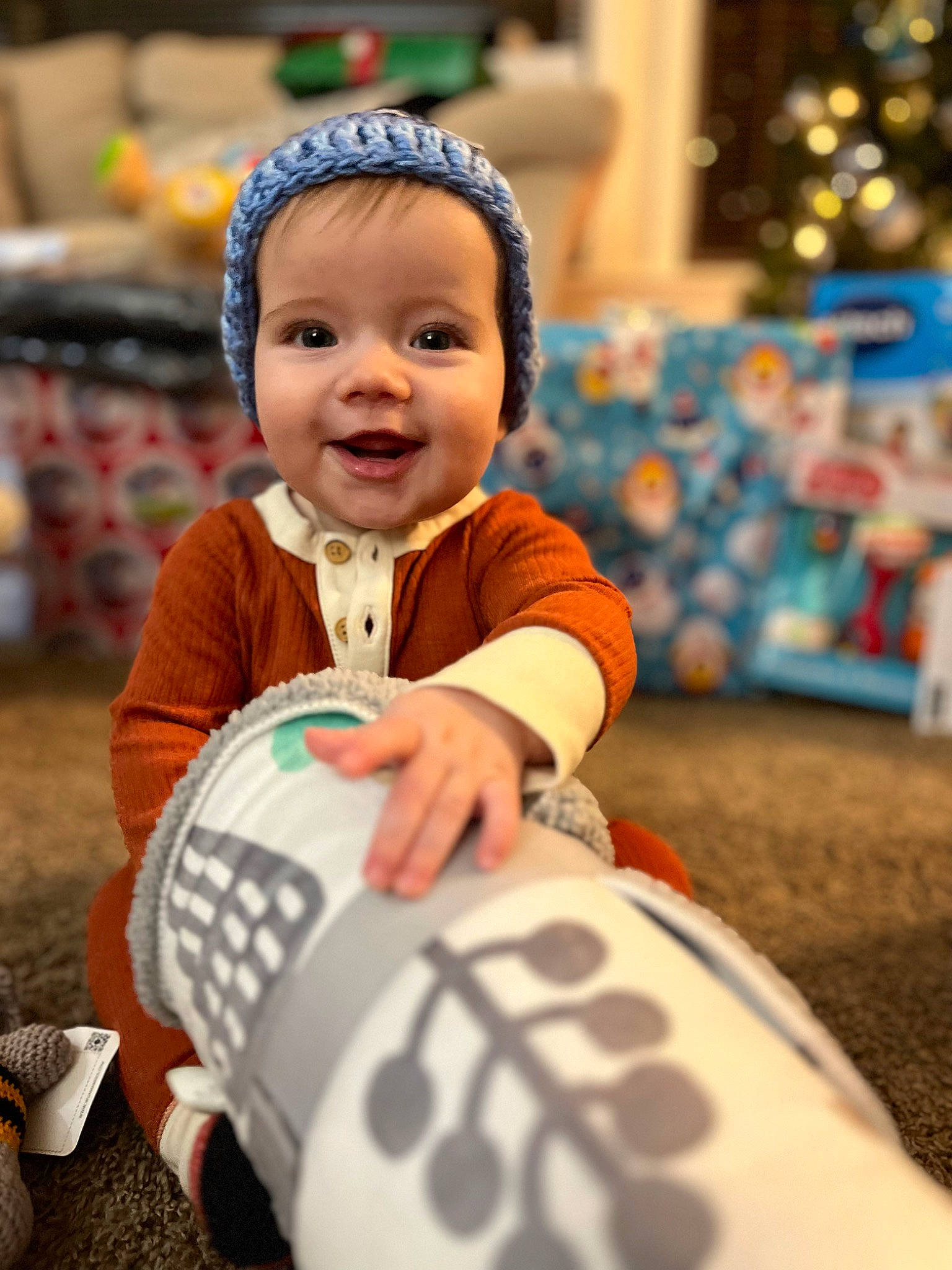 Owen is registered to the contest to win money with this photo: baby, carmine, child, city, event, fun, happy, holiday, human_leg, joy, laugh, leisure, person, personal_protective_equipment, play, portrait_photography, recreation, sitting, smile, t_shirt