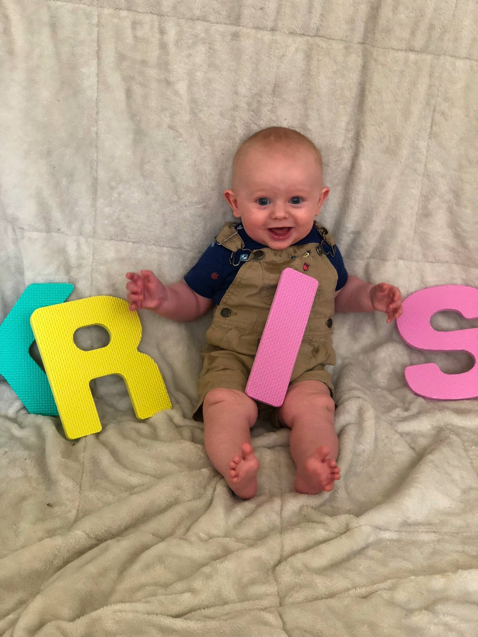 Kristopher is registered to the contest to win money with this photo: baby_products, child, day, finger, fun, hand, infant, joy, leg, material, person, play, product, sitting, skin, textile, toddler, toy
