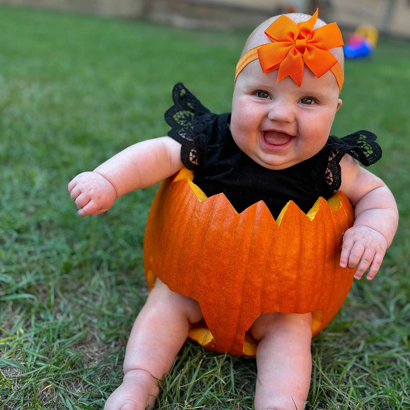 Brynley joined the competition — help win amazing prizes! baby, bodypart, clothing, face, finger, food, grass, hand, hat, head, lawn, leaf, person, photography, plant, portrait, produce, pumpkin, squash, vegetable