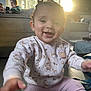 Anaiah joined the competition — help win amazing prizes! baby, child, couch, cozy, family, floor, happy, headband, indoors, living_room, people, person, pink_pants, portrait, smiling, sunlight, sweater, toy, window, winnie_the_pooh