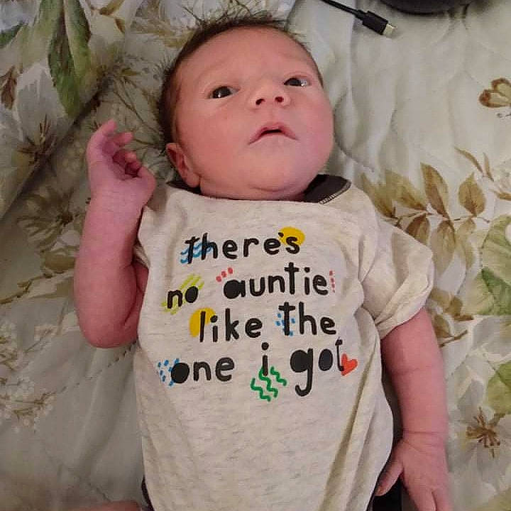 Caspian is registered to the contest to win money with this photo: arm, baby, baby_safety, baby_sleeping, baby_toddler_clothing, cheek, comfort, cool, eye, eyebrow, face, happy, head, outerwear, person, skin, sleeve, smile, textile, toddler