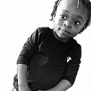 Yazmir Harris joined the competition — help win amazing prizes! child, toddler, braided_hair, black_shirt, jeans, standing, portrait, smiling, cute, young_child, innocent, studio, minimalist, fashion, person, happy, face, looking_away, casual, hands