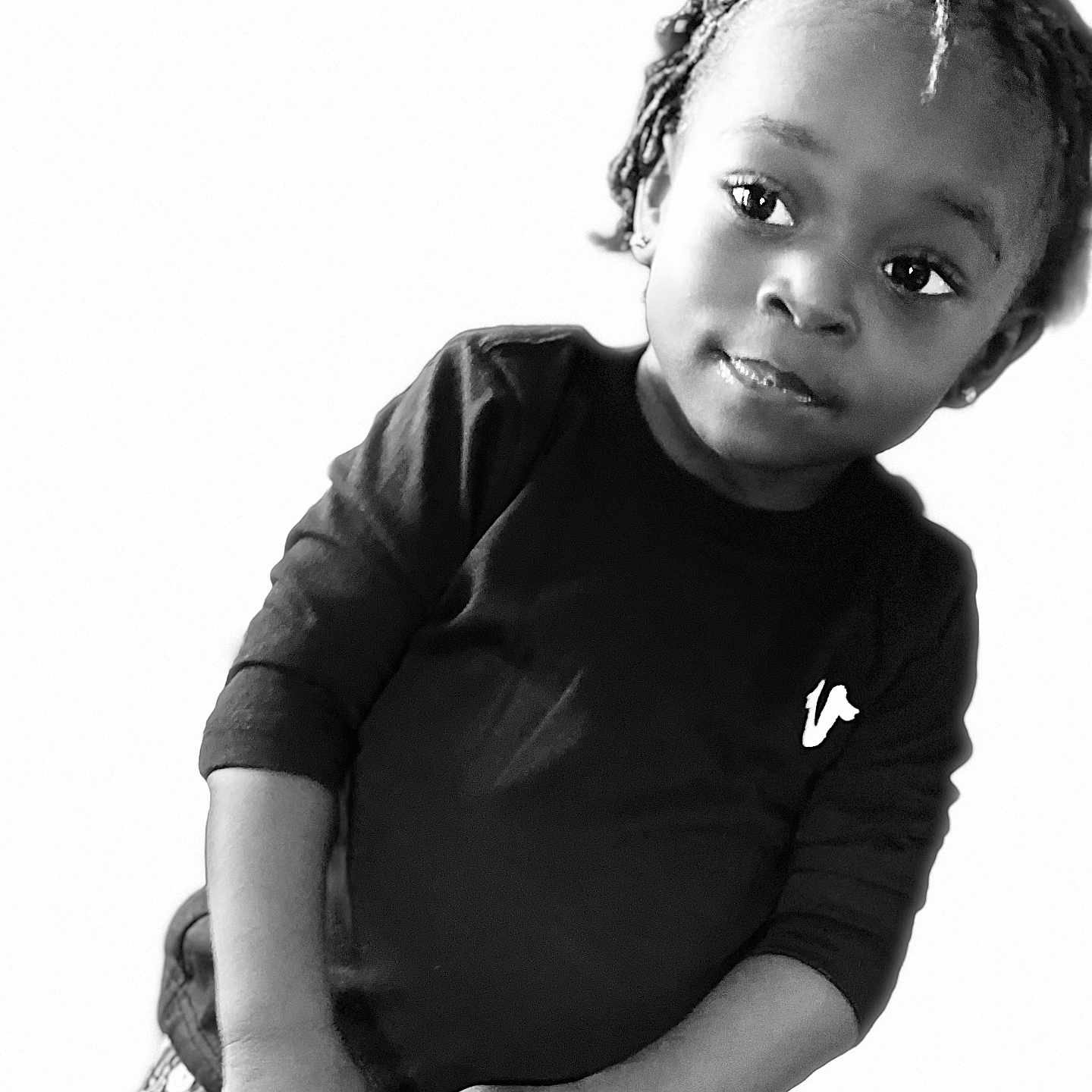 Yazmir Harris joined the competition — help win amazing prizes! black_shirt, braided_hair, casual, child, cute, face, fashion, hands, happy, innocent, jeans, looking_away, minimalist, person, portrait, smiling, standing, studio, toddler, young_child