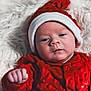 Emery joined the competition — help win amazing prizes! baby, infant, red_clothing, hat, santa_hat, blanket, white_blanket, face, hand, portrait, holiday, christmas, cute, newborn, soft_texture, warm_clothing, indoors, child, lying_down, expression