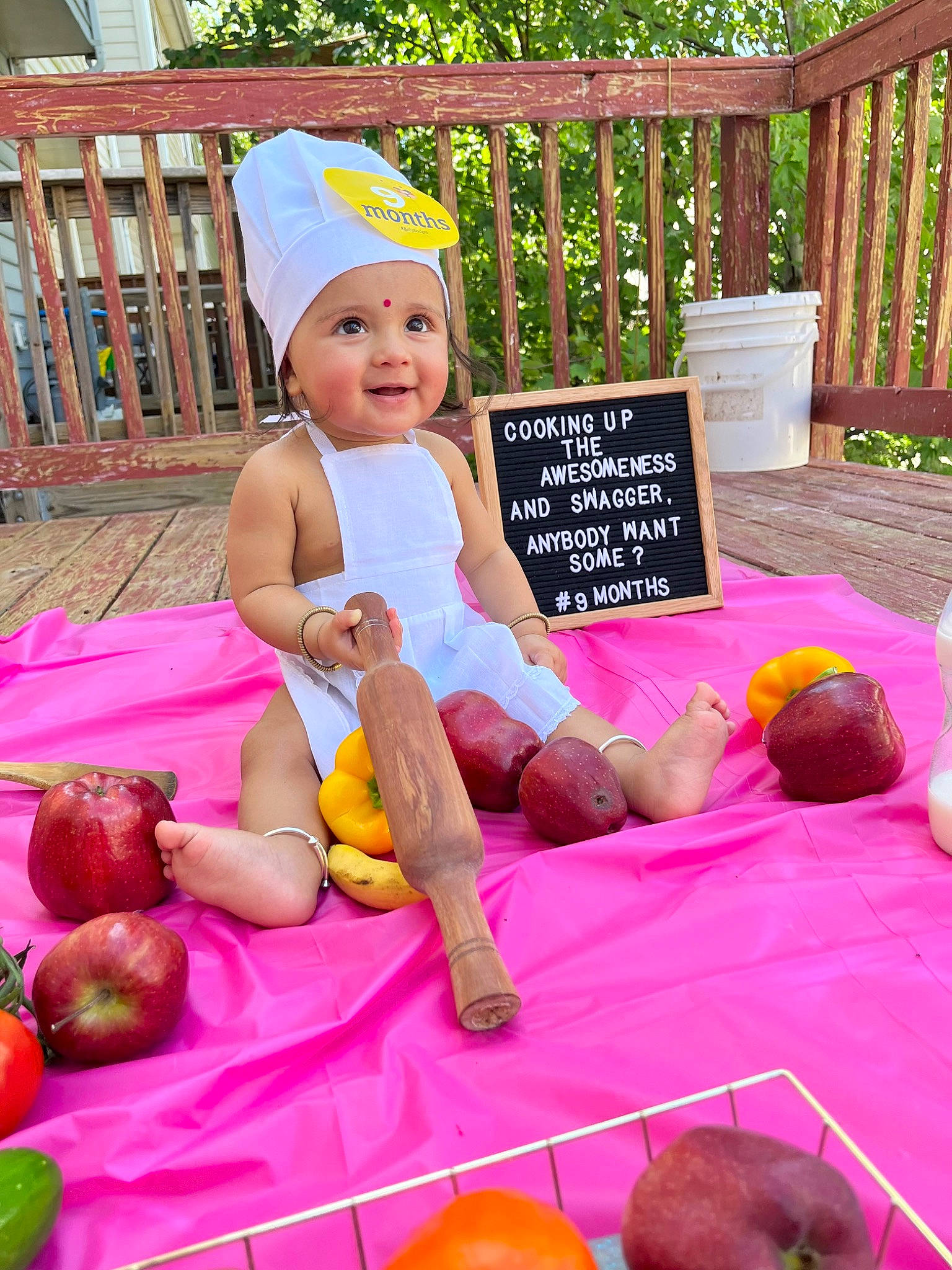Shara is registered to the contest to win money with this photo: baby, baby_toddler_clothing, child, event, fun, grass, happy, hat, headwear, joy, lap, leisure, magenta, party, person, pink, plant, purple, recreation, shorts