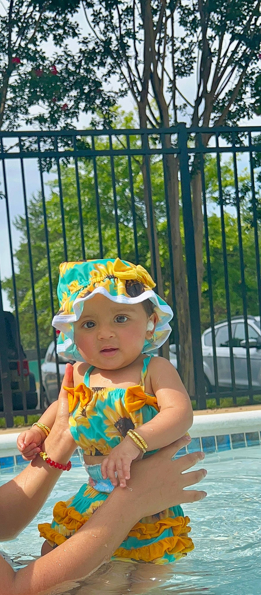 Shara joined the competition — help win amazing prizes! baby, baby_toddler_clothing, child, eyewear, fence, fun, goggles, grass, happy, hat, headgear, headwear, leisure, person, personal_protective_equipment, plant, recreation, sun_hat, swimming_pool, toddler