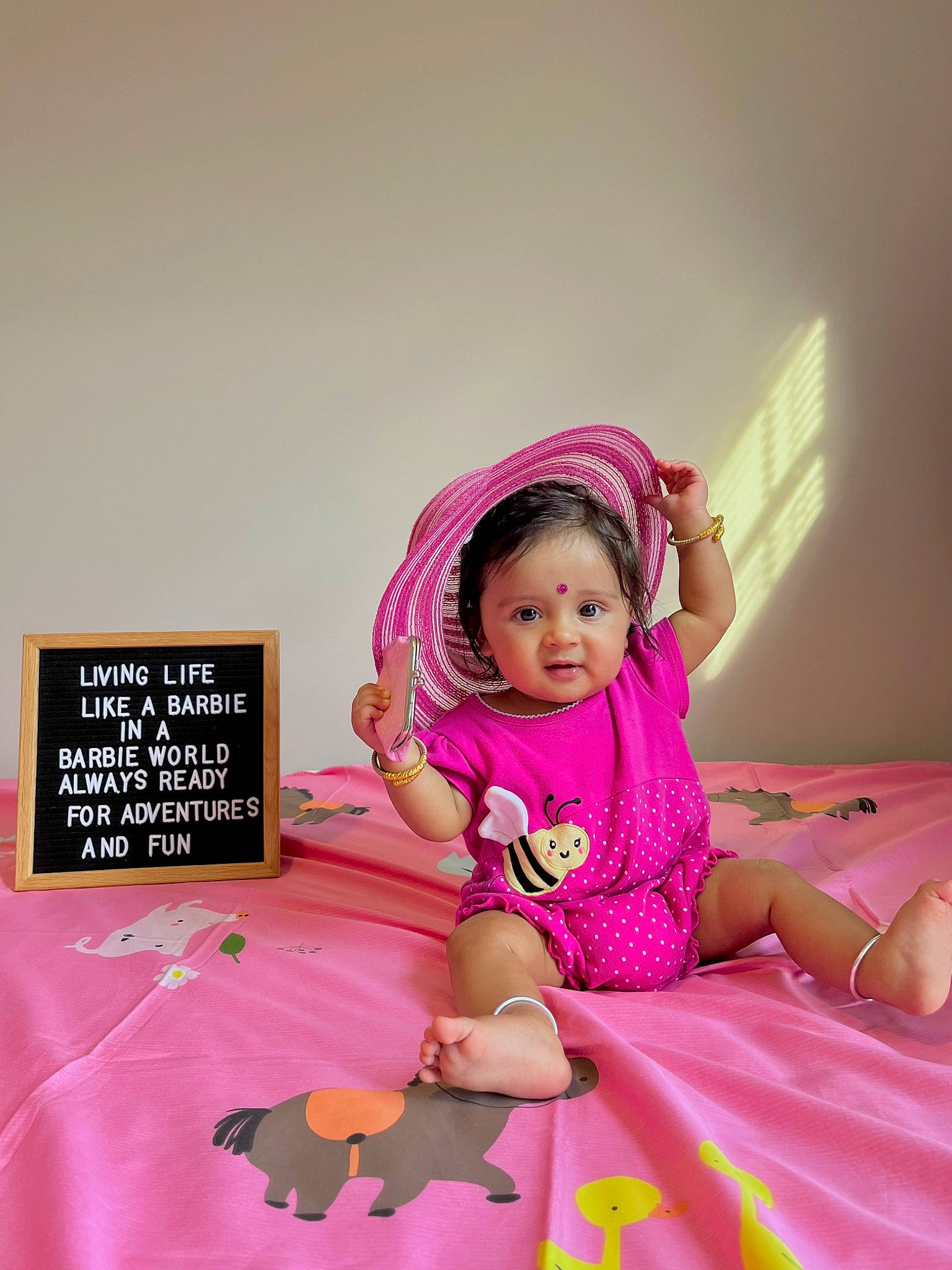 Shara joined the competition — help win amazing prizes! baby, baby_toddler_clothing, child, comfort, flooring, fun, happy, linens, magenta, pattern, person, petal, pink, purple, room, sitting, skin, sleeve, t_shirt, textile