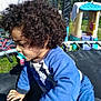 Elio participe au concours pour gagner de l'argent avec cette photo : child, toddler, curly_hair, pacifier, blue_clothing, trampoline, outdoor, playground, daylight, grass, toy_house, fence, bicycle, sunlight, person, playing, young_child, side_view, casual, active