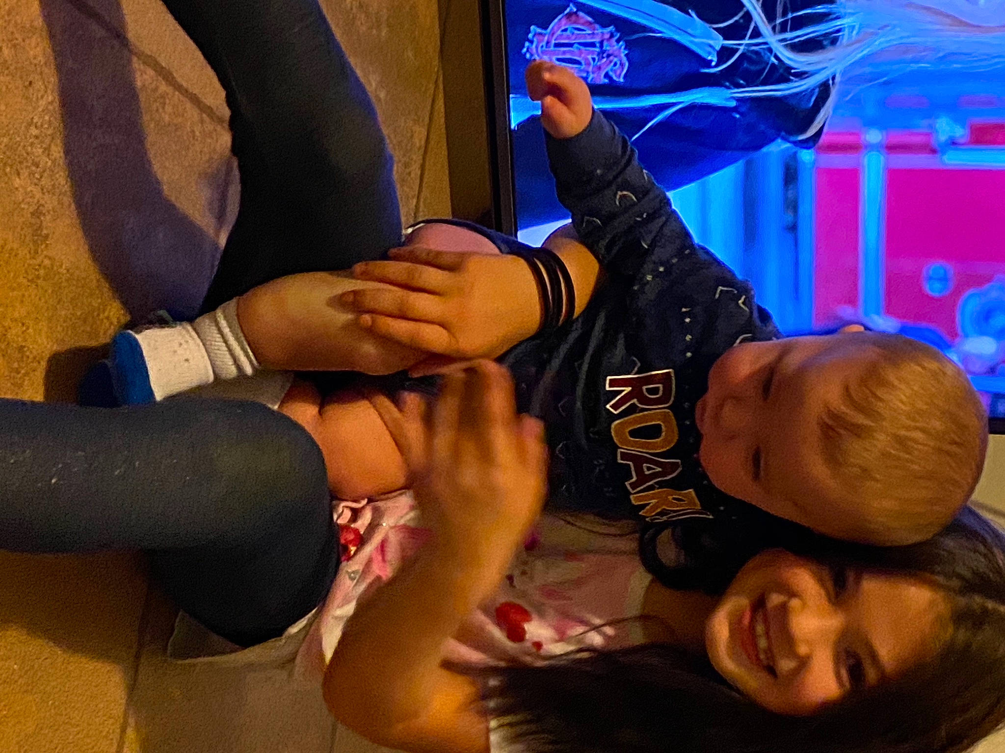 Karen is registered to the contest to win money with this photo: arm, cool, elbow, event, finger, foot, fun, gesture, hand, happy, human_leg, joint, joy, knee, leg, leisure, person, smile, sock, thigh