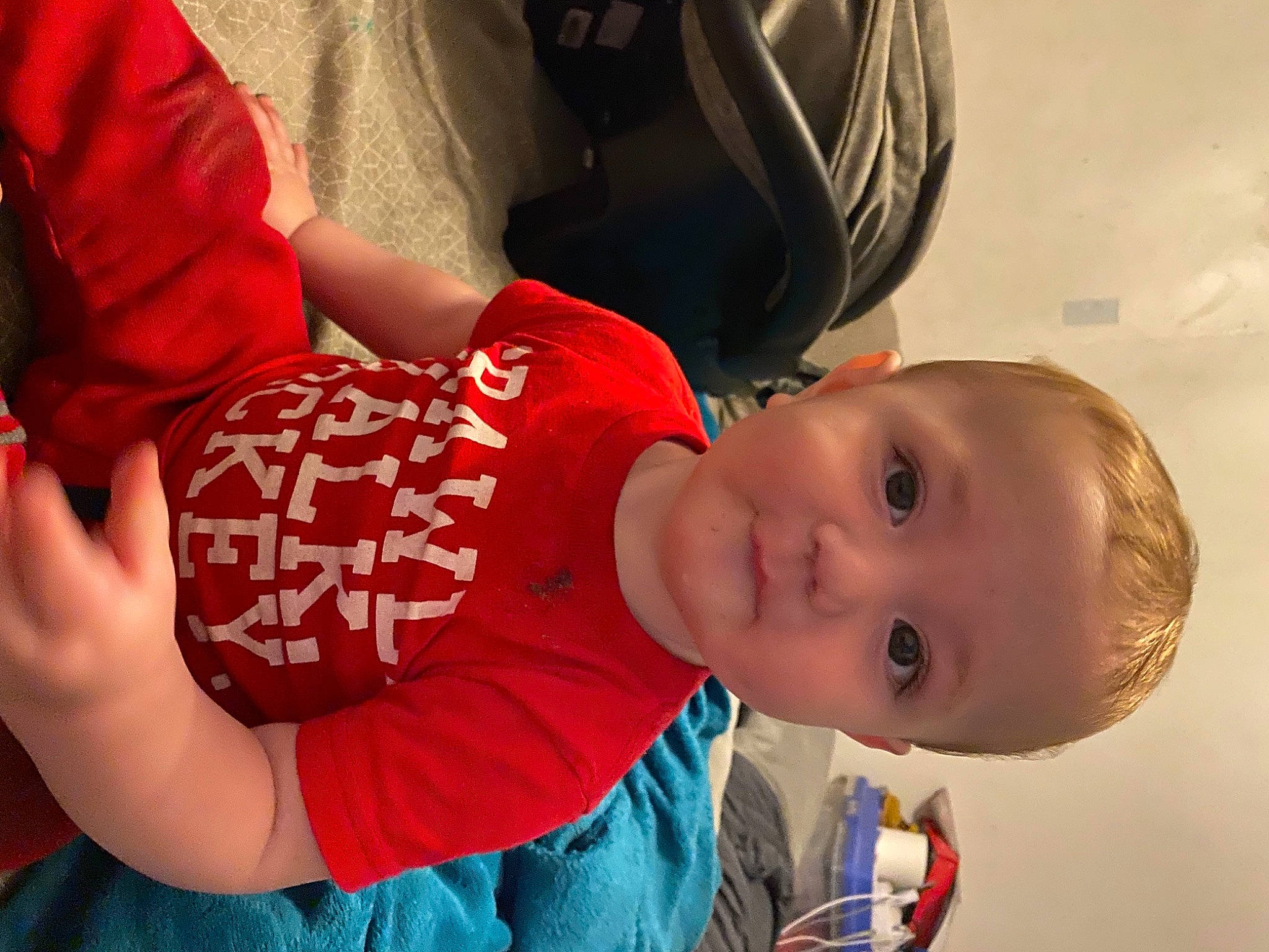 Brayden is registered to the contest to win money with this photo: baby, baby_products, baby_toddler_clothing, bicycle_helmet, child, elbow, fun, happy, helmet, leisure, mammal, mouth, nose, person, sitting, smile, sports_gear, t_shirt, toddler, tree