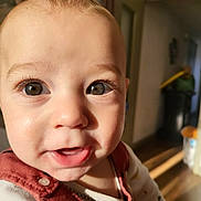 Marley participe au concours pour gagner de l'argent avec cette photo : baby, child, close_up, clothing, cute, expression, eyes, face, hair, hand, indoors, infant, light, mouth, person, portrait, skin, smile, sunlight, warm