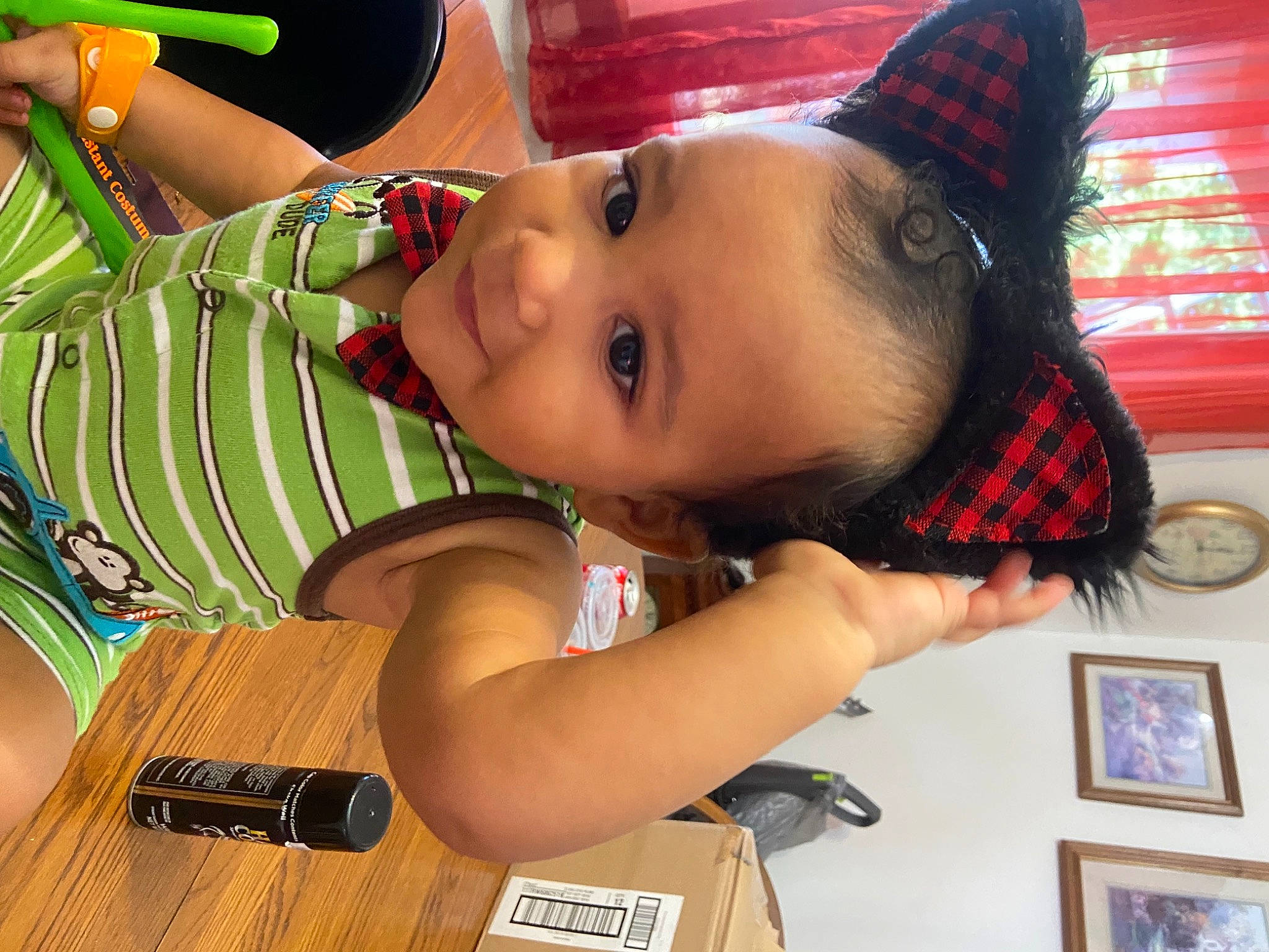 Kamari is registered to the contest to win money with this photo: arm, child, cool, eyelash, facial_expression, fashion_accessory, fun, happy, hat, human_body, lip, mouth, neck, nose, party_hat, person, picture_frame, skin, toddler, tree
