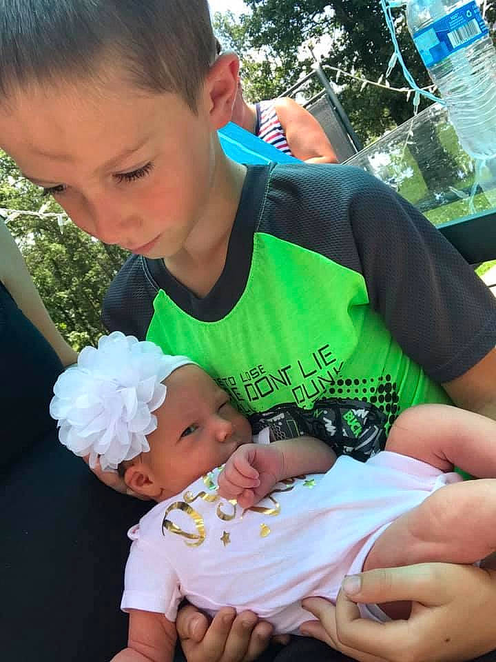 Kamilla joined the competition — help win amazing prizes! baby, baby_toddler_clothing, blue, eye, facial_expression, finger, fun, gesture, grass, hairstyle, happy, head, headwear, lap, leaf, mammal, person, photograph, product, summer