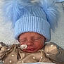 Teddie joined the competition — help win amazing prizes! newborn, baby, sleeping, hat, pom_poms, blanket, pajamas, stars, face, infant, hospital, medical_tape, cozy, soft, cute, resting, child, closeup, indoor, warm