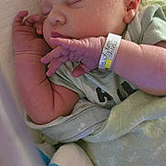 Maisie joined the competition — help win amazing prizes! baby, blanket, closeup, clothing, cute, face, hand, hospital_bracelet, indoors, infant, newborn, peaceful, person, portrait, resting, skin, sleeping, soft, toddler, wrapped
