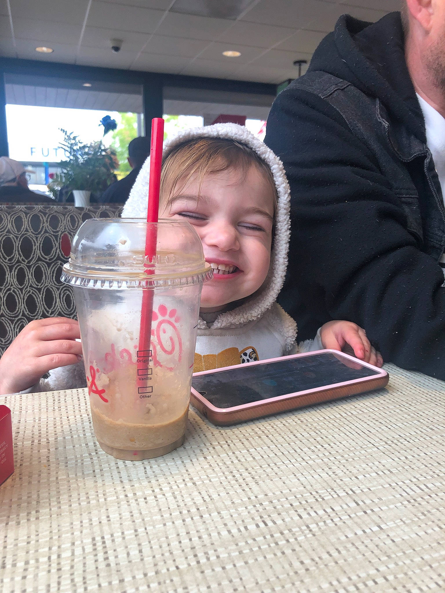 Ameara joined the competition — help win amazing prizes! carbonated_soft_drinks, child, cocktail, comfort_food, drink, drinking, drinking_straw, drinkware, finger, fun, glass, houseplant, non_alcoholic_beverage, person, smile, soft_drink, table, tablet_computer, tableware, toddler