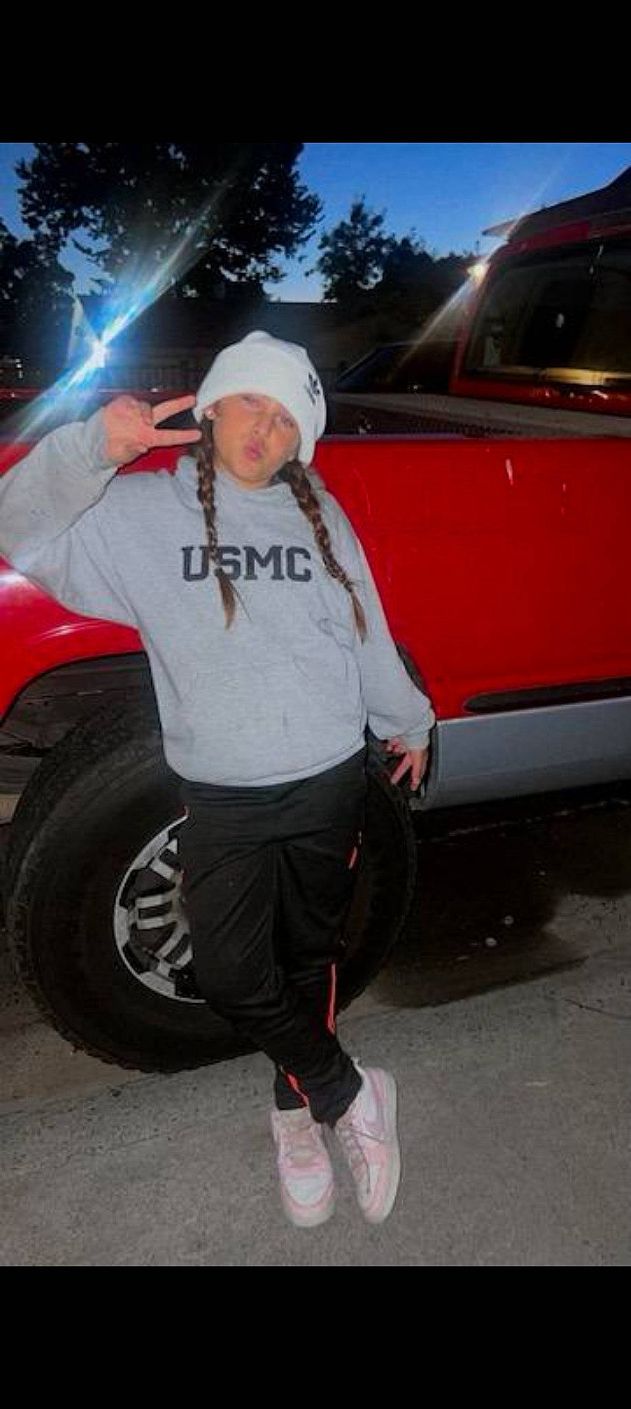 Aura Renn is registered to the contest to win money with this photo: alloy_wheel, asphalt, auto_part, automotive_design, automotive_exterior, automotive_lighting, automotive_tire, automotive_wheel_system, bumper, car, fender, hat, headwear, hood, motor_vehicle, person, rim, tire, tread, vehicle