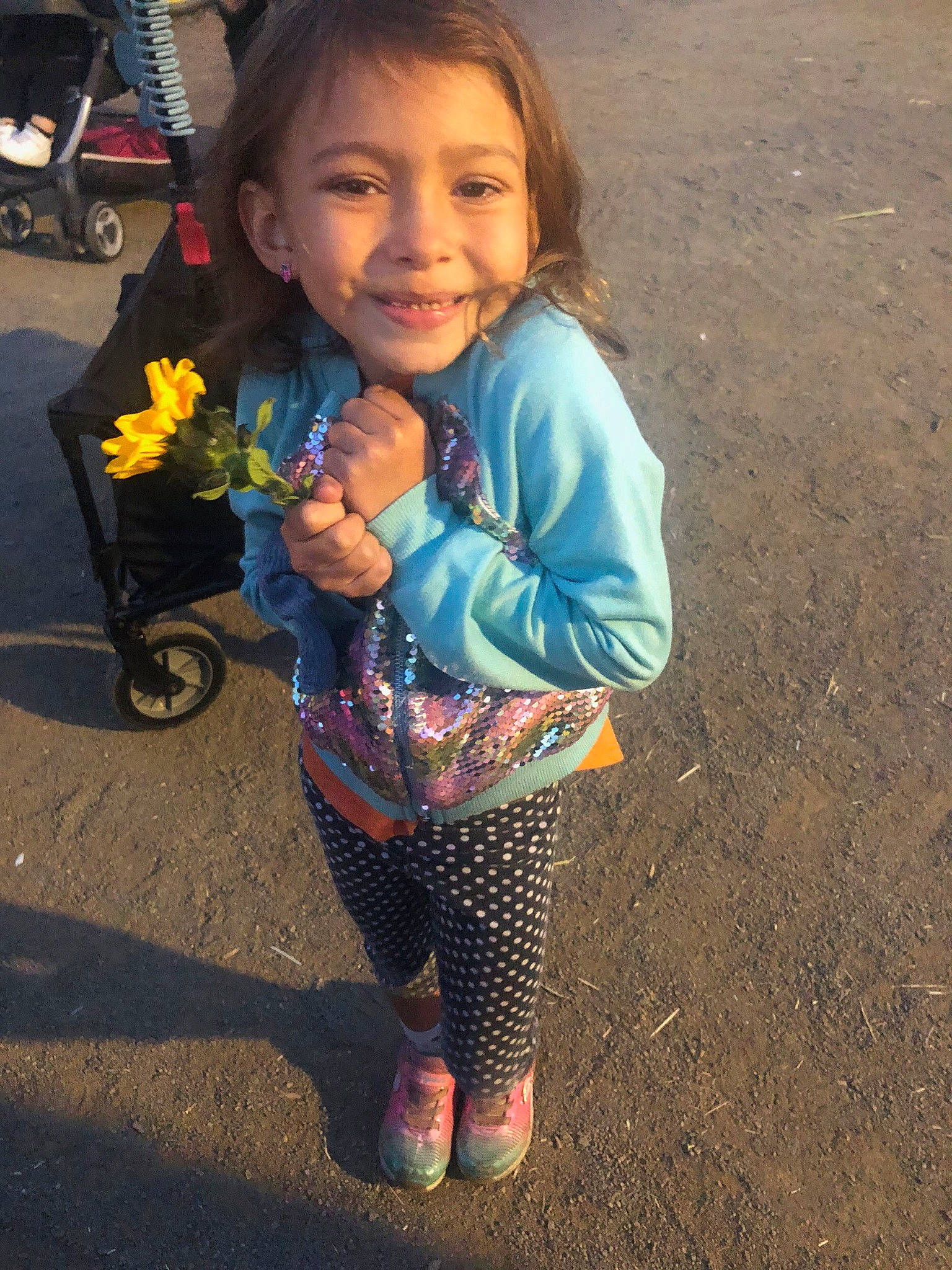 Astraea joined the competition — help win amazing prizes! baby_toddler_clothing, child, electric_blue, eye, face, flower, fun, hair, happy, head, iris, joy, leg, pattern, person, sitting, sleeve, smile, soil, tire