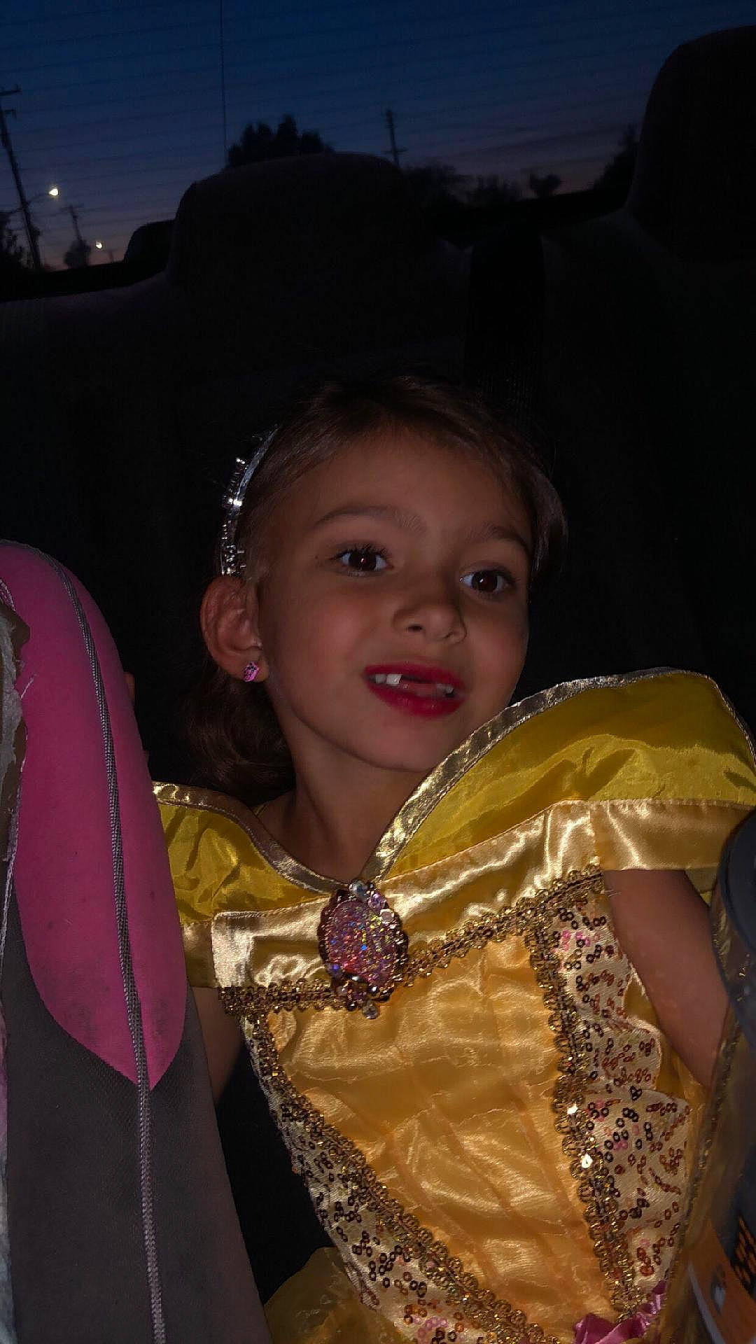 Astraea is registered to the contest to win money with this photo: abdomen, cheek, child, costume, event, fashion_accessory, fashion_design, festival, formal_wear, fun, happy, iris, jewellery, joy, magenta, necklace, night, person, skin, smile