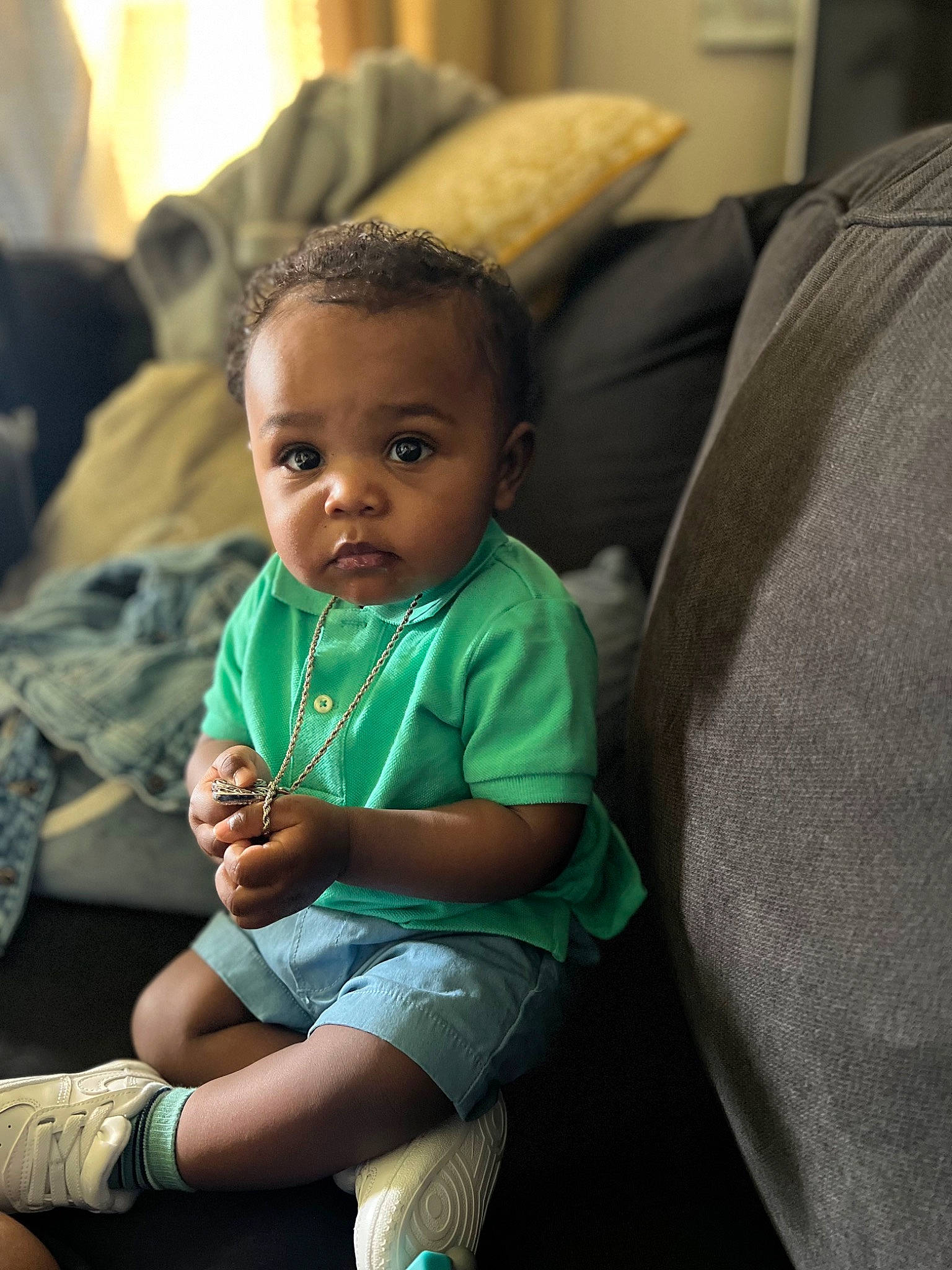 Kasyn is registered to the contest to win money with this photo: baby, baby_toddler_clothing, cheek, child, comfort, couch, finger, fun, happy, human_body, iris, mammal, people, person, sitting, skin, smile, standing, toddler, vacation