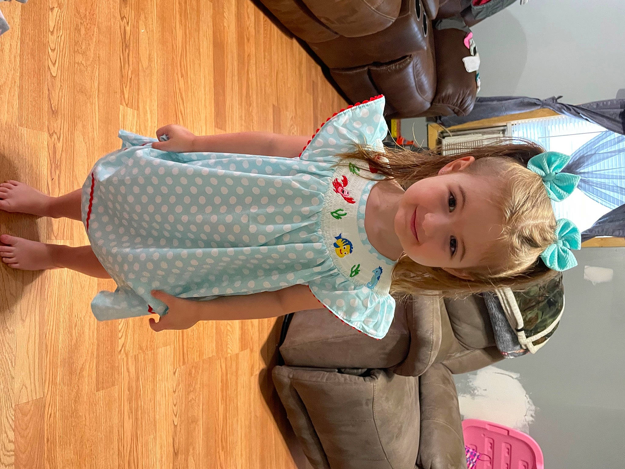 Caroline is registered to the contest to win money with this photo: abdomen, baby, baby_products, baby_toddler_clothing, car_seat, child, comfort, family_car, flooring, fun, hardwood, joint, joy, person, sitting, skin, sleeve, toddler, vehicle_door, waist
