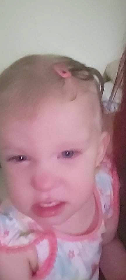 Becca-ann is registered to the contest to win money with this photo: baby, black_hair, cheek, chin, ear, eyebrow, eyelash, forehead, happy, headgear, iris, jaw, lip, mouth, neck, nose, person, pink, skin, smile