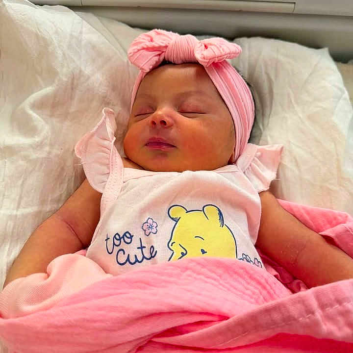 Lillie joined the competition — help win amazing prizes! baby, newborn, sleeping, pink_blanket, headband, cute_clothing, infant, peaceful, cartoon_bear, soft_fabric, indoor, child, adorable, resting, toddler, baby_girl, wrapped, portrait, bed, cozy
