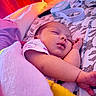 arm, baby, bed, blanket, child, colorful_lighting, cozy, cute, fabric, face, indoor, infant, nap, pajamas, pattern, peaceful, person, resting, sleeping, soft