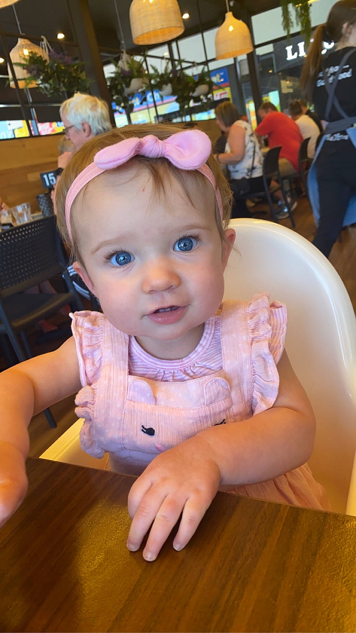 Eve is registered to the contest to win money with this photo: baby, baby_toddler_clothing, chair, cheek, child, event, finger, flooring, fun, happy, hardwood, iris, leisure, mammal, person, recreation, sitting, skin, toddler, vacation